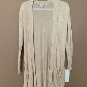 A long cream cardigan with pockets!